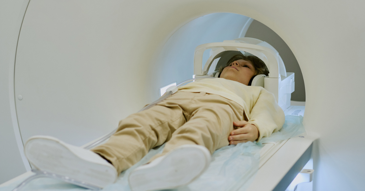 two teenagers looking down on their smartphone